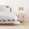 A bedroom scene with a bed and a nightstand. Produktbild-Vorschau