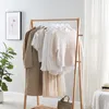 Clothing on a rack in a room. Produktbild-Vorschau