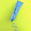 A tube of Curaprox toothpaste with a swirl of toothpaste on a bright green background. Náhled obrázku produktu