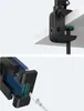 A close-up view of a black clamp attached to a white surface, and a close-up of a phone holder with a charging cable. Podgląd zdjęcia produktu