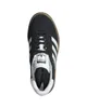 A top-down view of a black Adidas Gazelle sneaker with white stripes and a gum sole. Produktbild-Vorschau
