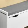 A close-up view of a white storage bench with a gray cushion. Produktbild-Vorschau