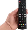 A hand holding a black LG remote control against a white background. Produktbild-Vorschau