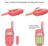 Instructions for installing and disassembling the battery of a pink walkie-talkie. Produktbild-Vorschau
