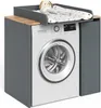 A washing machine cabinet with a changing mat and a stuffed animal on top. Voir les images du produit