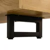 A close-up view of the underside of a wooden furniture piece, showing a black metal support frame and leg. Voir les images du produit
