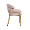 A side view of a pink velvet armchair with gold metal legs and accents, isolated on a white background. Produktbild-Vorschau