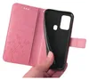 A hand holding a pink flip phone case, revealing the black inner shell where a phone would be placed. Produktbild-Vorschau