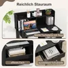 A black desk with a laptop, books, and decorative items, shown with close-up insets highlighting storage features. Produktbild-Vorschau