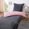 A bed with bedding in a bedroom setting. Produktbild-Vorschau