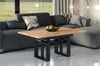 A modern living room with a sectional sofa and a coffee table. Voir les images du produit