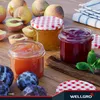 Jars of jam and fresh fruit on a wooden table. Produktbild-Vorschau