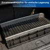 A black and gray dog ramp is shown in the trunk of a car. Náhľad obrázku produktu