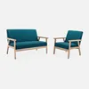 A teal loveseat and armchair with wooden frames are displayed against a white background. Anteprima dell’immagine prodotto