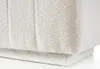 A close-up view of a white textured fabric, likely a piece of furniture. Produktbild-Vorschau