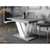 A dining table with chairs in a modern dining room setting. Produktbild-Vorschau
