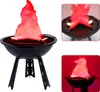 A decorative LED flame light designed to look like a campfire or grill, displayed on a white background with inset images showing details. Produktbild-Vorschau