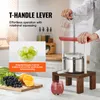 A person using a fruit press in a kitchen setting, with fruits and juice displayed. Náhľad obrázku produktu