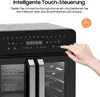 Close-up of the control panel of a black and silver dual zone air fryer, with a hand touching the power button. Náhľad obrázku produktu