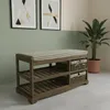 A shoe bench with storage baskets in a room setting with artwork and a plant. Podgląd zdjęcia produktu