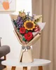 A 3D wooden puzzle bouquet is displayed on a white table. Produktbild-Vorschau