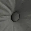 A close-up view of a dark gray tufted cushion with a button. Produktbild-Vorschau