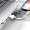 A white USB hub is connected to a laptop and a smartphone, with a USB flash drive plugged into the hub. Produktbild-Vorschau