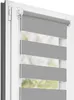 A close-up view of a gray and white striped roller blind installed in a white window frame. Produktbild-Vorschau