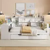 A white multifunctional daybed with a built-in bookshelf and desk, set against a light beige wall. Podgląd zdjęcia produktu