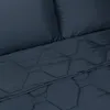 A close-up view of a dark blue comforter with a geometric pattern. Produktbild-Vorschau