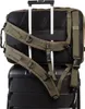 The back of a backpack is attached to the handle of a rolling suitcase. Voir les images du produit