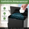 A hand is shown dropping a crumpled piece of paper into an open, black, sensor-activated trash can. The lid is open, and blue concentric circles indicate the sensor's range. Text overlays describe the sensor's features. Podgląd zdjęcia produktu