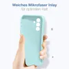 A hand holding a light blue phone case against a white background. Produktbild-Vorschau