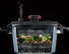 A cross-section of a pressure cooker steaming vegetables. Produktbild-Vorschau