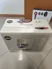 A product box for a Lavazza coffee machine is shown, with a Dyson hair dryer box in the background. Náhľad obrázku produktu