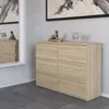 A modern dresser with six drawers is shown in a well-lit room with a large mirror reflecting part of the dresser and a decorative wall. Produktbild-Vorschau