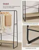 A close-up view of a clothing rack with a shelf, highlighting its stability features. Produktbild-Vorschau