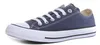 A single navy blue Converse Chuck Taylor All Star low-top sneaker with white laces and a white rubber toe cap and sole, shown from a side angle on a white background. Produktbild-Vorschau