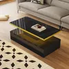 A modern coffee table with a glossy black top and yellow accents sits on a wooden floor next to a couch. Voir les images du produit