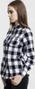 A woman is shown from the side wearing a black, white, and red checkered flannel shirt. Náhled obrázku produktu