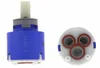 Two ceramic disc cartridges for a faucet, one shown from the side and the other from the top. Produktbild-Vorschau