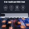 A close-up of a multi-port USB-C hub with icons representing its functions. Produktbild-Vorschau