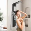 A woman is showering under a modern black shower panel system. Náhľad obrázku produktu