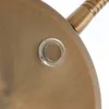 A close-up shot of a bronze-colored lamp base with a clear plastic grommet. Anteprima dell’immagine prodotto