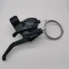 A black bicycle gear shifter with a cable is placed on a white background. Anteprima dell’immagine prodotto