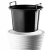 A black planter insert sits inside a white decorative pot with a wavy pattern. Voir les images du produit