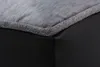 A close-up view of the corner of a dog bed, showing the seam between the gray fabric top and the black faux leather bottom. Produktbild-Vorschau