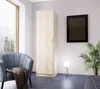 A modern room with a wardrobe, armchair, and a floor lamp. Náhled obrázku produktu