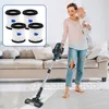 A woman is vacuuming while holding a baby. Produktbild-Vorschau