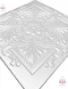 A close-up, angled view of a white decorative ceiling or wall panel with ornate embossed patterns. Produktbild-Vorschau